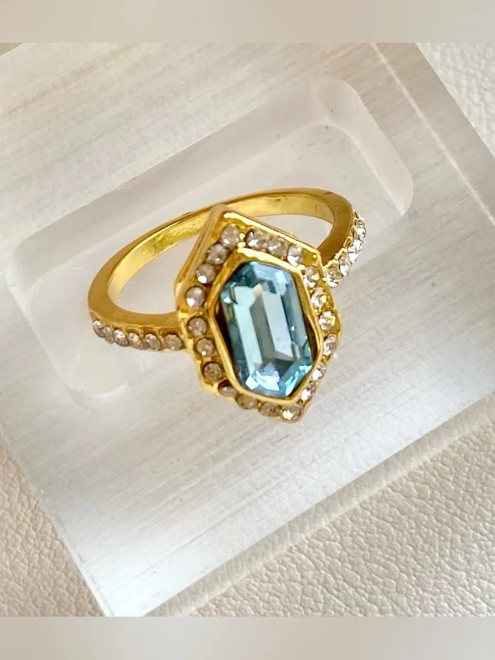 Gold Ring with Blue Gemstone and Clear Accent Stones